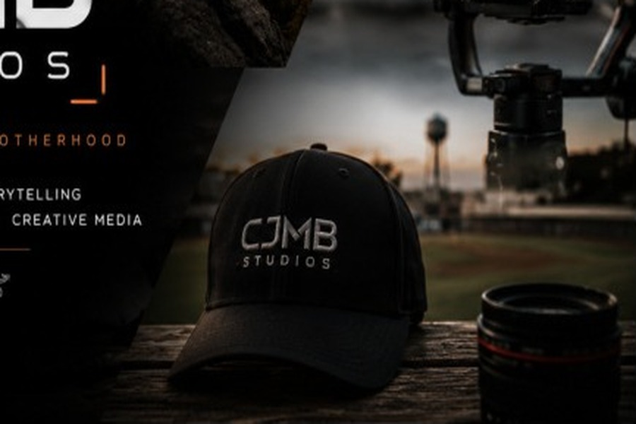CJMB Studios hat and camera lens